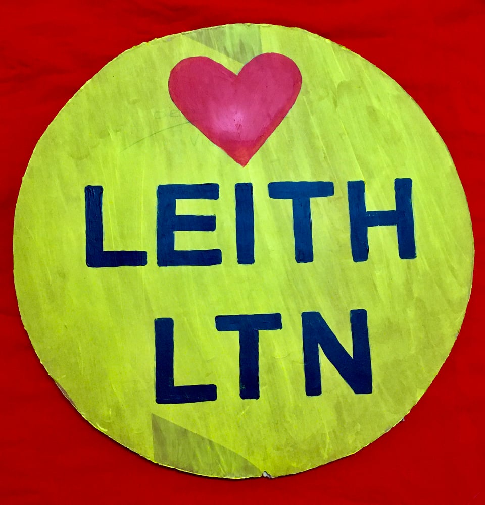 A colourful red banner features a bright yellow circle with a love heart and 'LEITH LTN