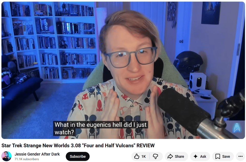 Screenshot of a YouTube still from the channel Jessie Gender After Dark. The video is titled “Star Trek Strange New Worlds 3.08 ‘Four and a Half Vulcans’ Review” and the still is of Jessie Gender herself looking exasperatedly into the camera. The closed-captions read “What in the eugenics hell did I just watch?”
