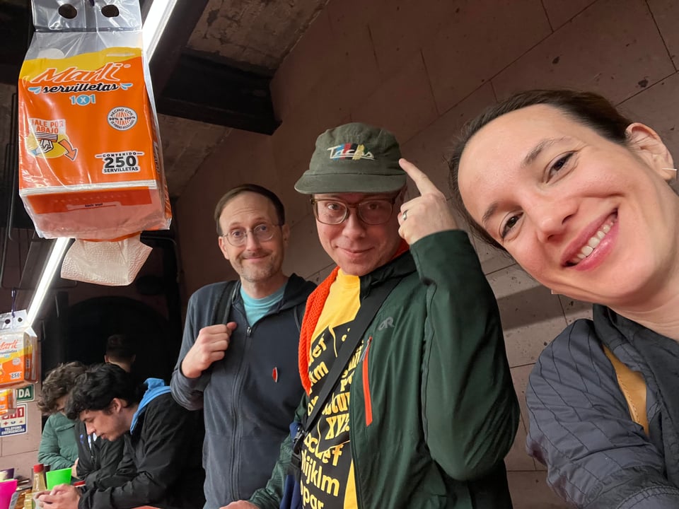 Ben pointing to his Tacos hat