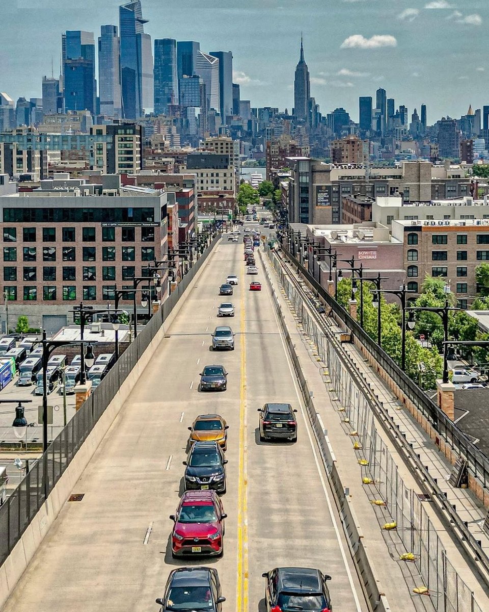aerial shot of viaduct with construction barriers creating a safe path for people on two wheels