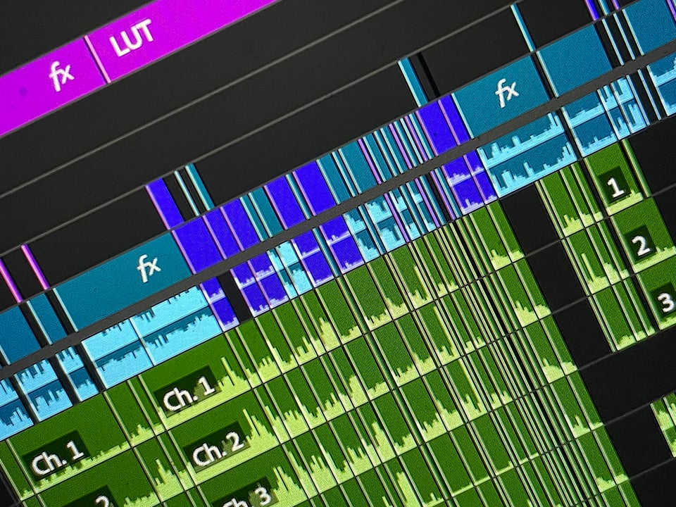 A close-up screen capture of all the stacked video and audio files in the editing program Premiere Pro