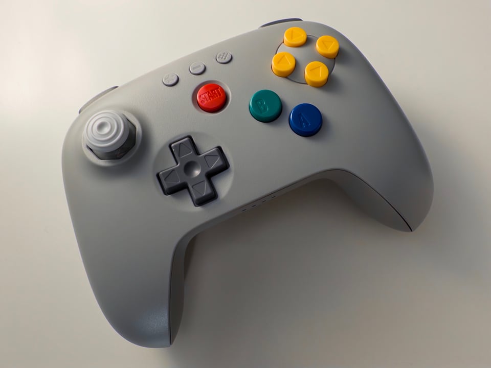 Gray 8BitDo 64 controller, fancy buttons