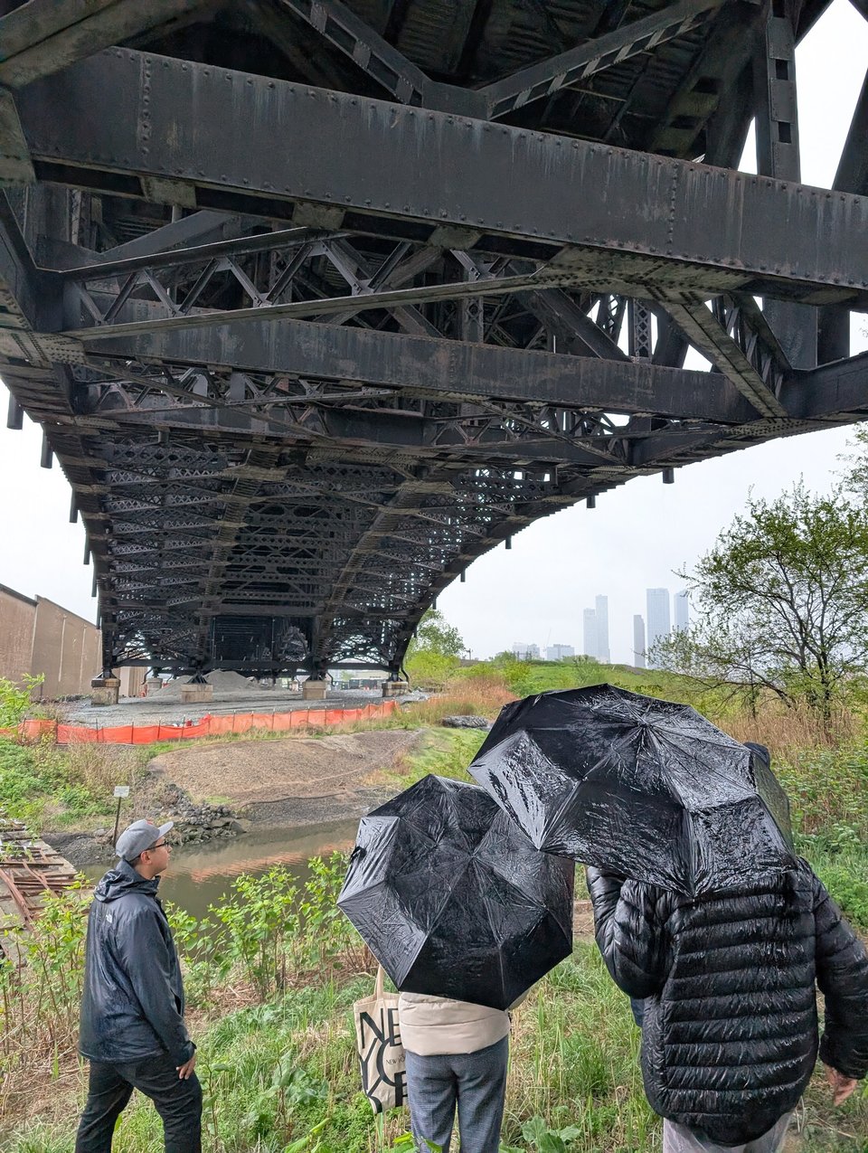 Councilman Joel Brooks inspecting the underside of the Pulaski Skyway on an infrastructure tour