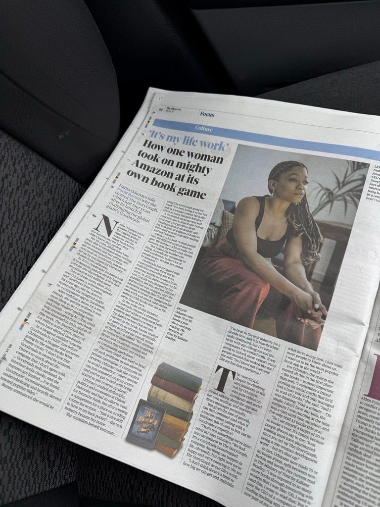Photo of full page spread in The Observer newspaper. A large photo of me sitting on a sofa and staring out into the distance is in the top right quadrant.