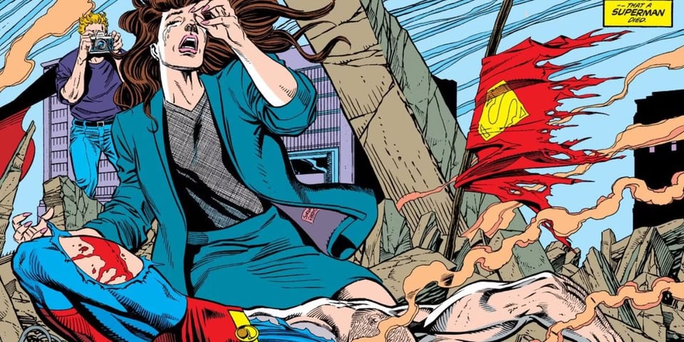 An iconic image from the Death of Superman comic... Lois Lane, a white lady with brown hair wearing a blue pantsuit, is weeping over the dead body of Superman, a white beefy guy. Superman's iconic costume is torn to expose his hairy chest, and his cape is hanging like a flag in the rubble. Jimmy Olsen is taking photos from a distance because he's a heartless bastard.