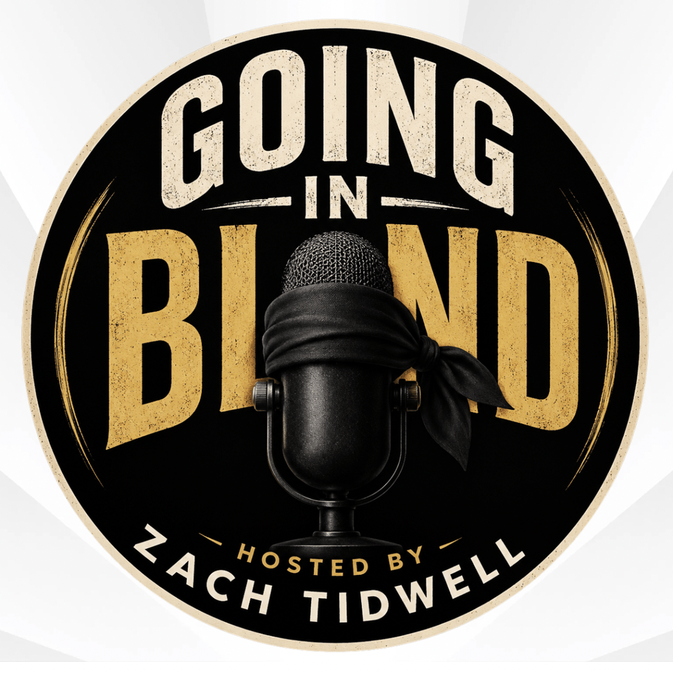 The Going in Blind logo, featuring a microphone with a blindfold dangling from it.