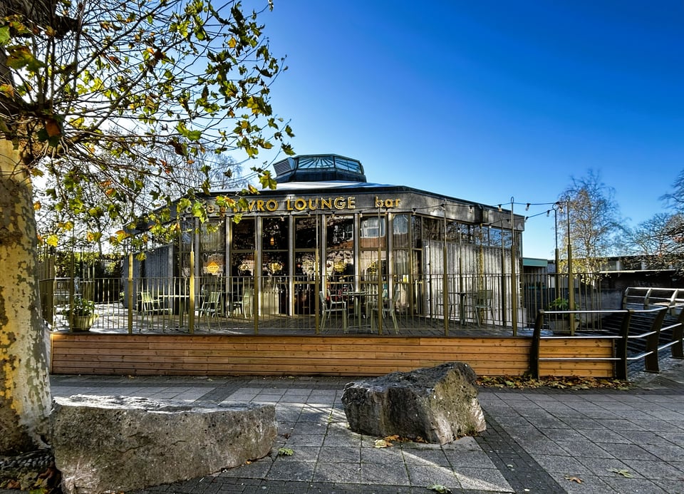 The exterior, showing raised decking along several sides of the building.