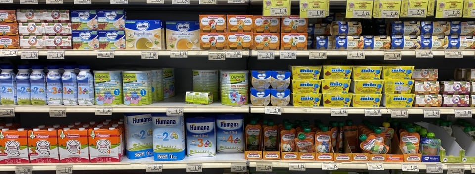 Supermarket shelves showing a bewildering array of baby foods in different formats and packages