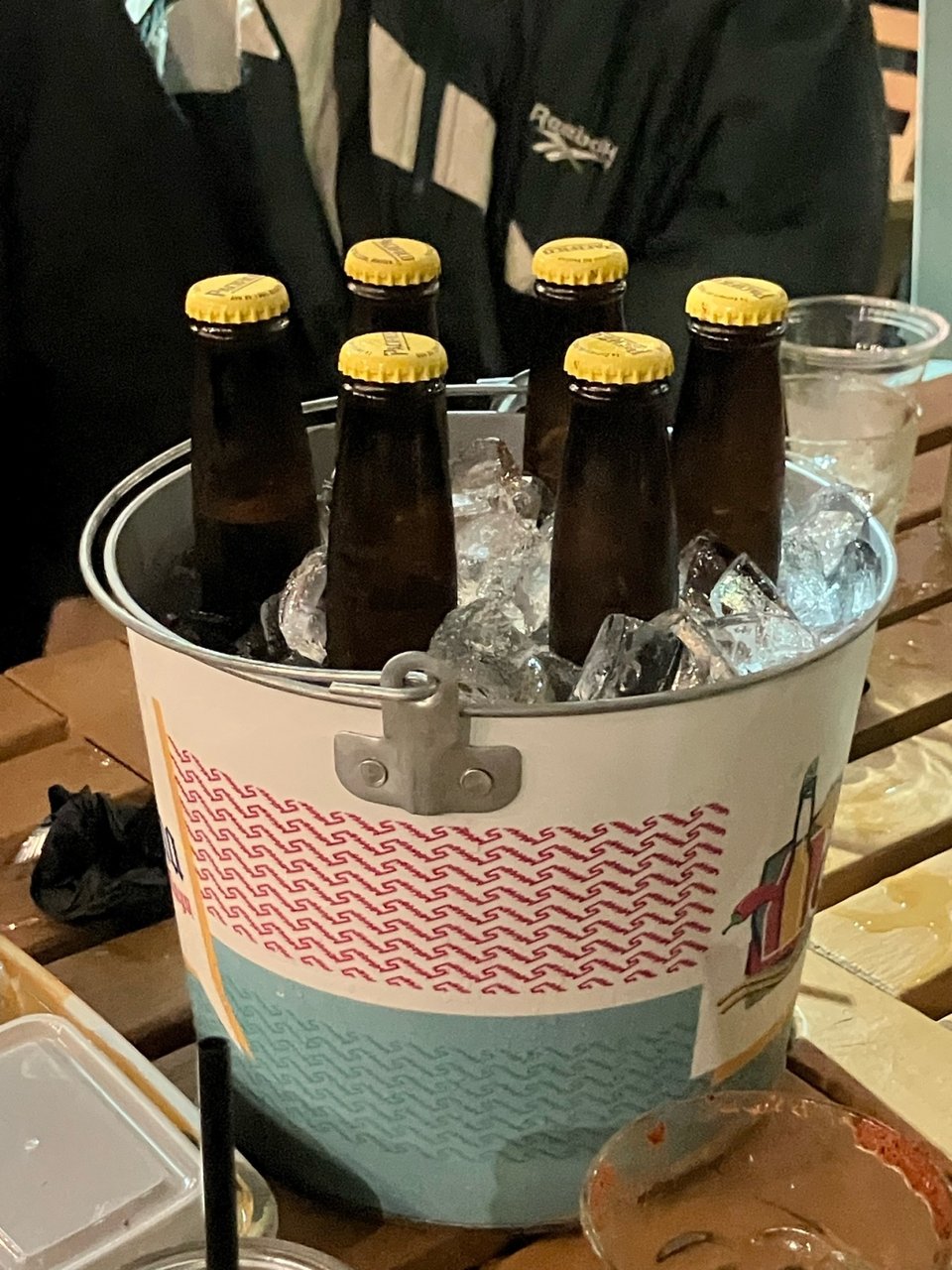 A bucket filled with ice and beers.