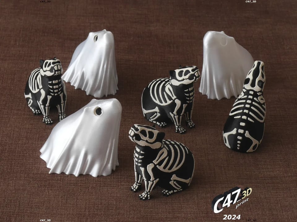A group of capybara skeletons with little ghost sheets in the shape of the animal