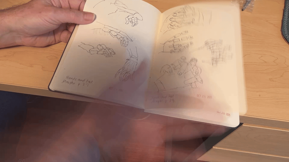 a still photo of a sketchbook flipthrough