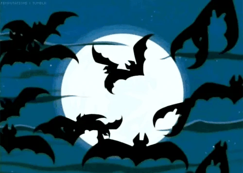 Animated bats flapping against a moon lit sky