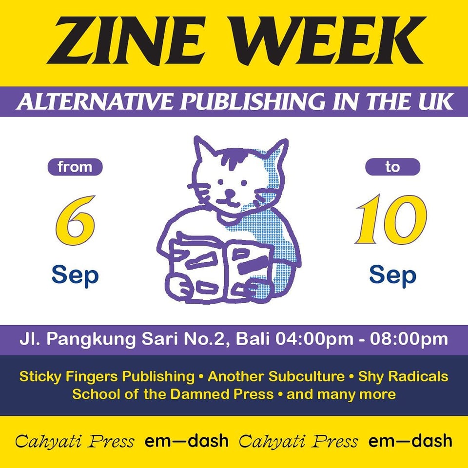 A cat reading a zine!