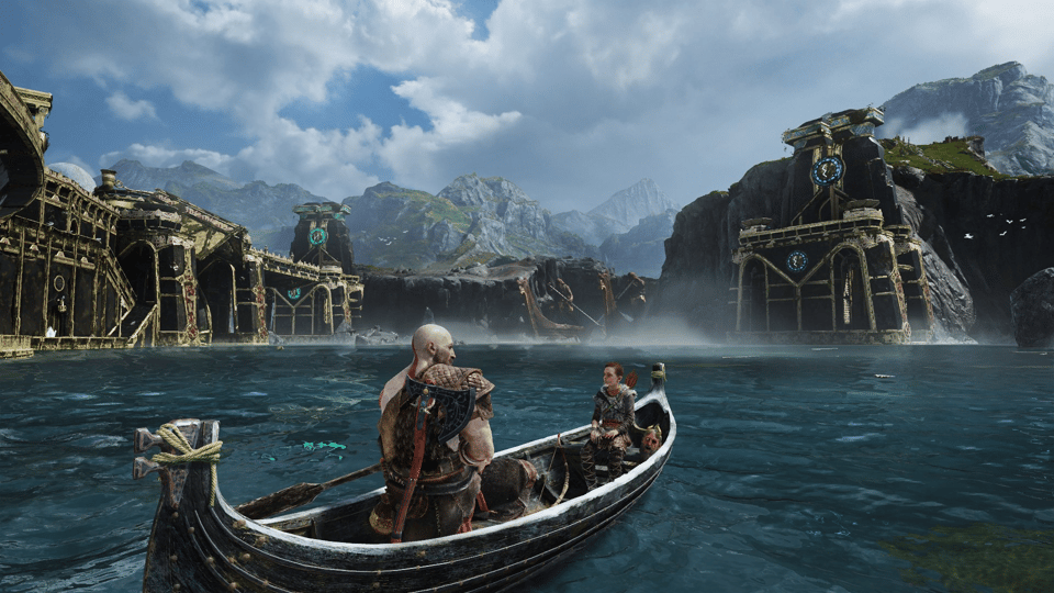A screenshot from God of War (2018) showing Kratos, Atreus, and Mimir's head in a boat on a lake.