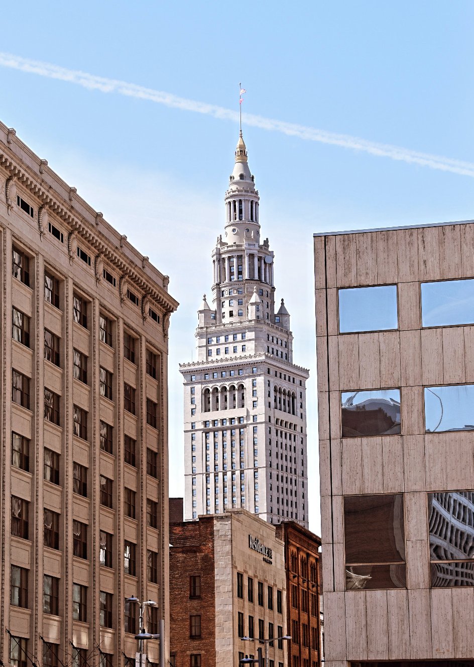 A tower between two shorter buildings.
