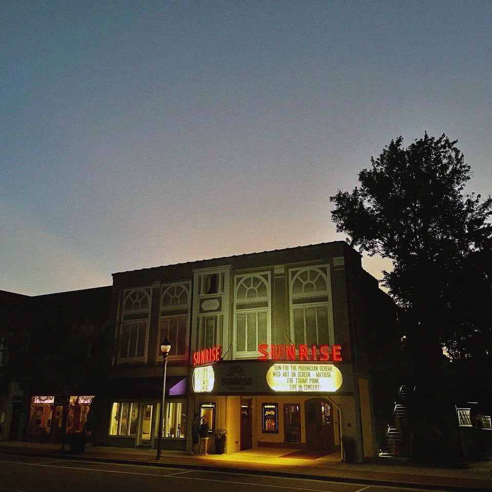 the sunrise theater in southern pines, north carolina just after a screening of the latest Wes Anderson movie at dusk