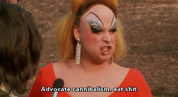 Divine in Pink Flamingos with the caption "Advocate cannibalism, eat shit."