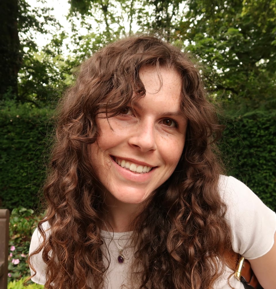 a woman with curly hair