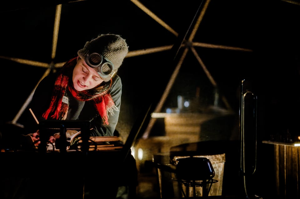 Actress inside the dome of Polar Nights, writing and monologuing