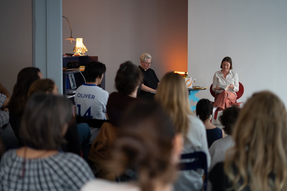 Staci and Anna Arov are seated in conversation at Page Not Found in the Hague in front of an audience.