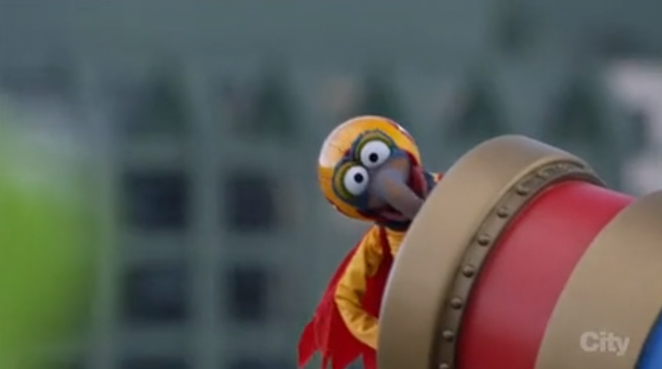 Gonzo, the muppet, in a cannon, about to be fired into the air.