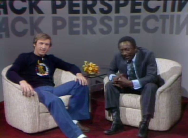 two men sitting in chairs with the words black perspective black perspective