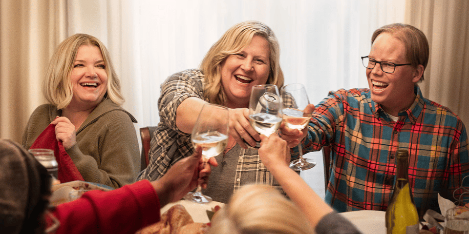 A group of friends share a toast.