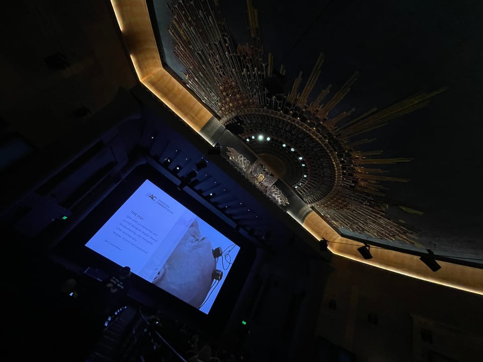 A screen advertises THX-1138 in a big gorgeous theater