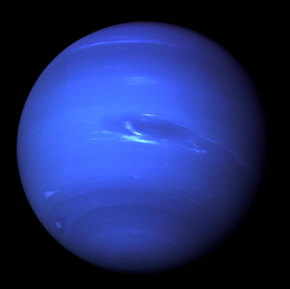 Giant picture of Neptune taken by Voyager 2 showing the Great Dark Spot in the southern hemisphere