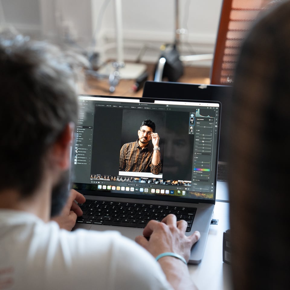 An image of people looking at an image.