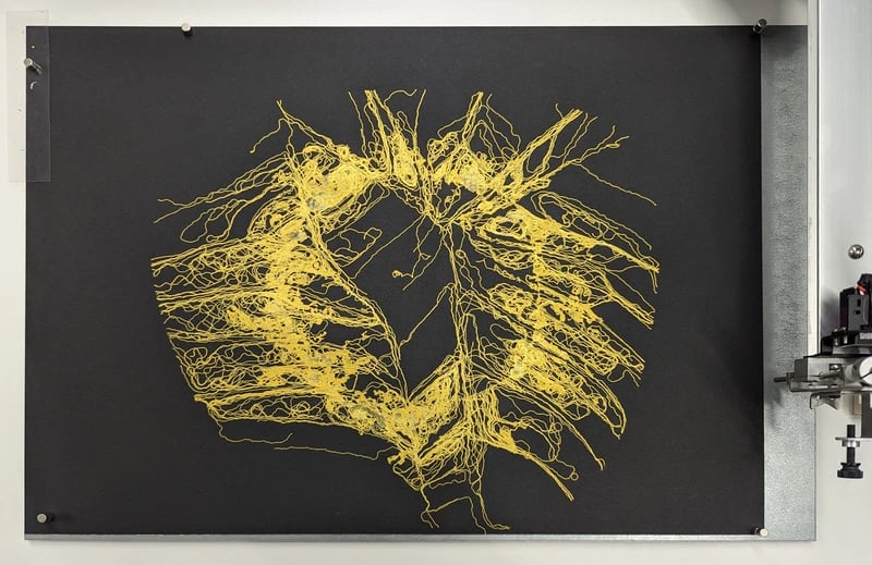 A complex pen plotted organic design with golden ink on black paper. Based on a plant leaf.