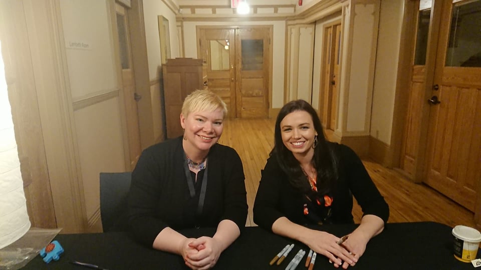 Kate and Shannon are grinning like two writers living the dream, with our pens laid out in front of us.