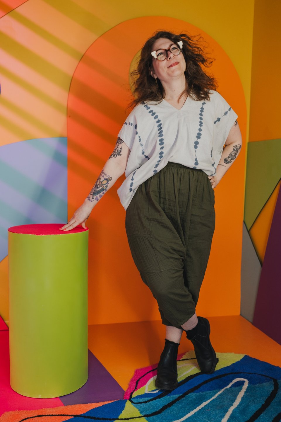 kate standing and smiling in a colorful background