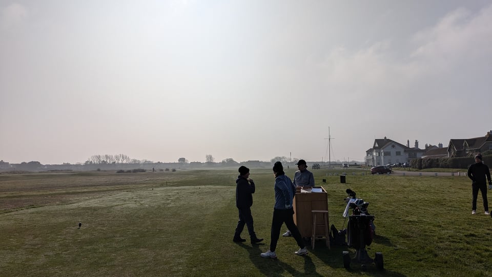 On the first tee box at Deal with the starter, now clear of fog