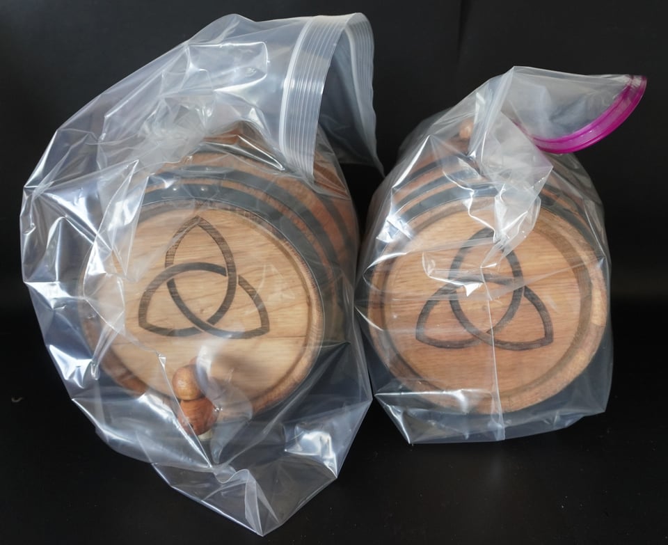 Charred oak kegs in plastic bags