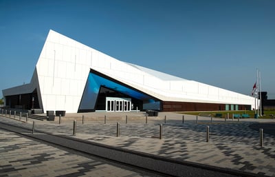 CSTM entrance plaza and main building, which is sharp and angular, rising to a high apex.