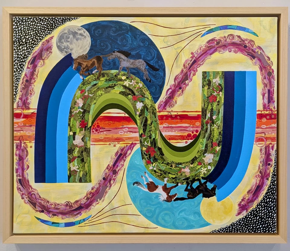 "Cycles" completed, hanging in a light wood floater frame. A brightly colored mixed media on canvas depicting horses running under the sun and moon in a sort of infinity shape, with sections of bold acrylic paint colors and sections of paper collage.