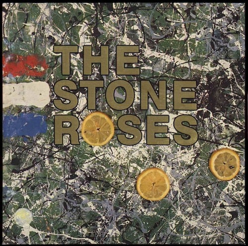 This is a painting in a Jackson Pollock style, of splatters of white and black paint on a dark green background. On the left are three thick strips of paint, one red, one white, one blue. There are three circular slices of an orange or lemon on the canvas as well. THE STONE ROSES in gold lettering is in the center, and one of those slices forms the O of Roses.