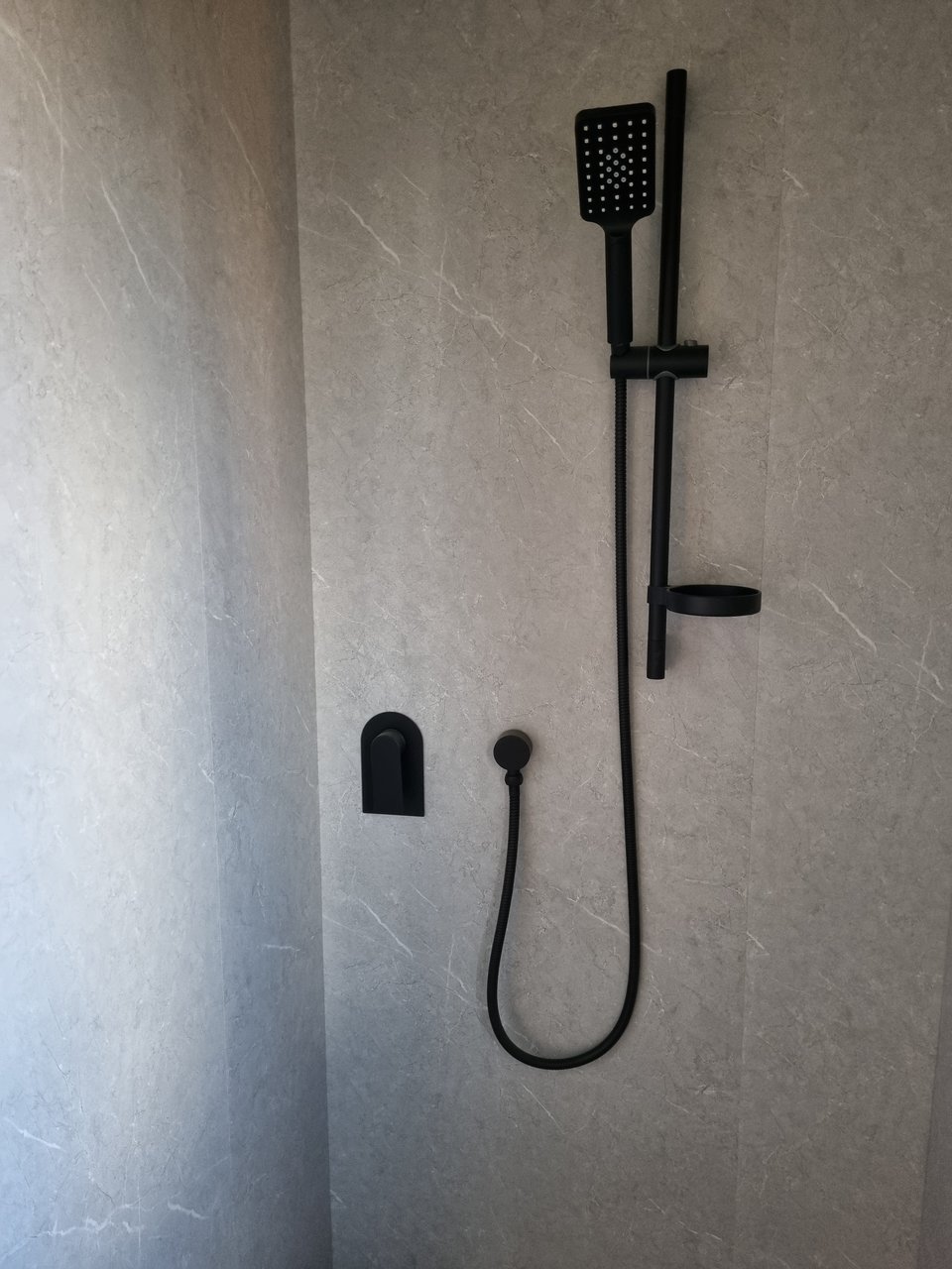 Shower walls in and bathroom fixtures installed
