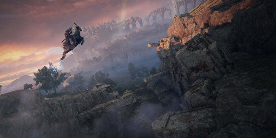 A scene from Elden Ring. The player, riding a steed named Torrent, leaps through the air over a canyon. On either side are gigantic stone slabs that look like gravestones, embedded into the canyon walls at all angles, including perpendicular. A pink-hued sun sets in the background over a castle town and a collapsed bridge leading to it.