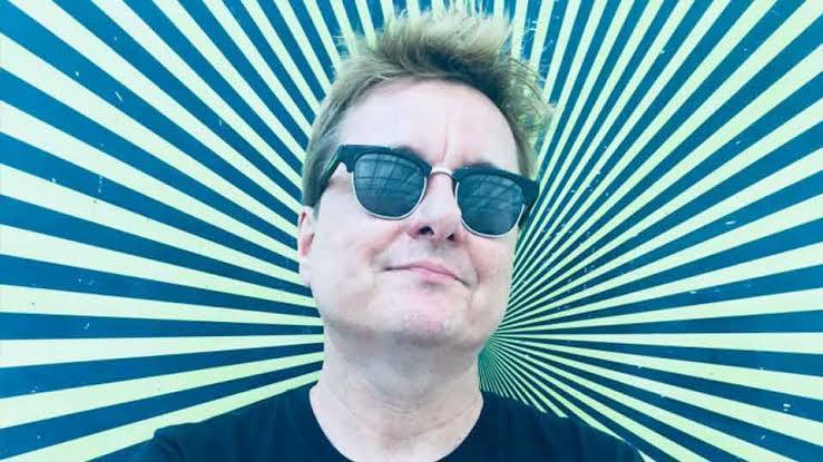 Portrait of a Lithuanian-American animation and comics creator wearing sunglasses against a bold striped background, joining BLON to share insights into his distinctive creative world.