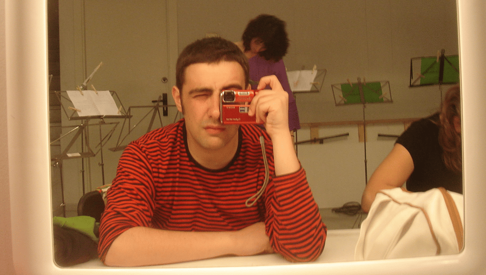 a man taking a picture of himself in a mirror