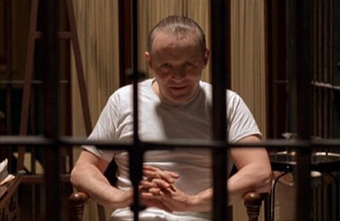 Hannibal Lecter sitting in a jail cell