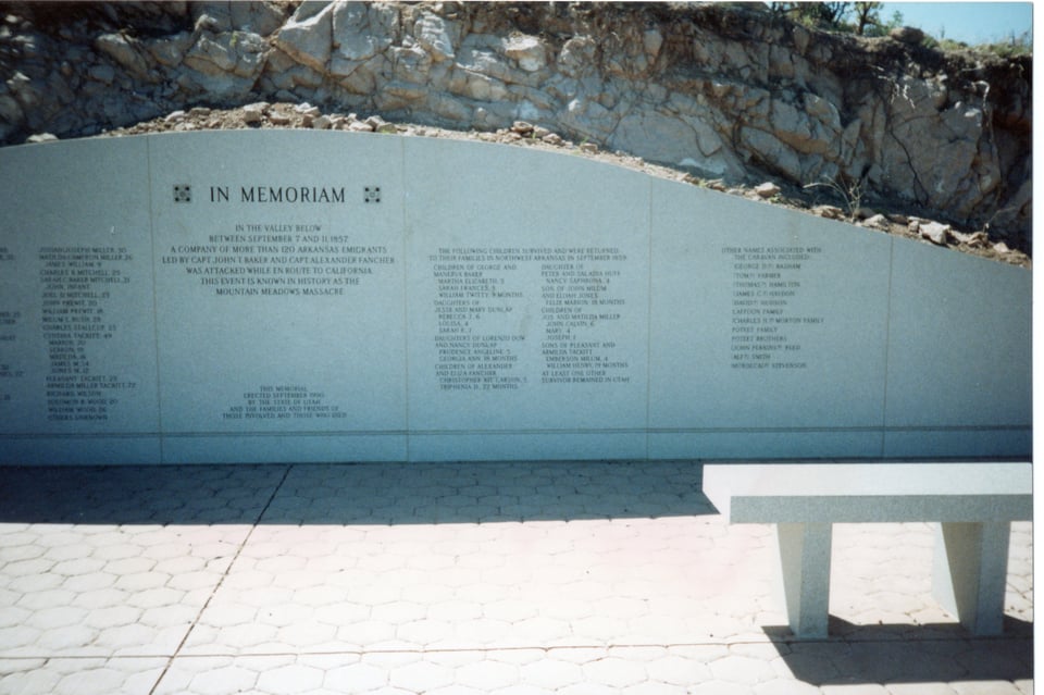 A stone memorial wall inscribed with names of those killed at Mountain Meadows.