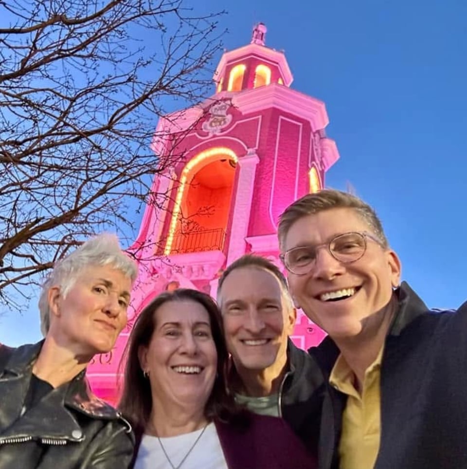 Two women and two men standing in front of a lurid pink faux-Mexican bell tower. L to R: Me, Robyn, Marco and Mark.