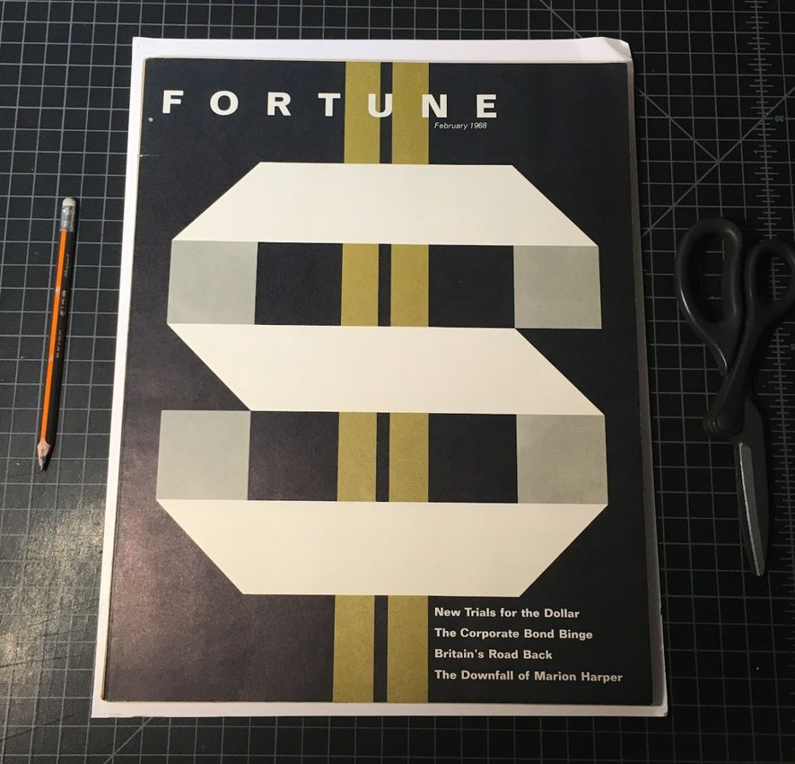 FORTUNE magazine cover with a dollar sign illustration like adding machine tape over a double yellow line that is gold
