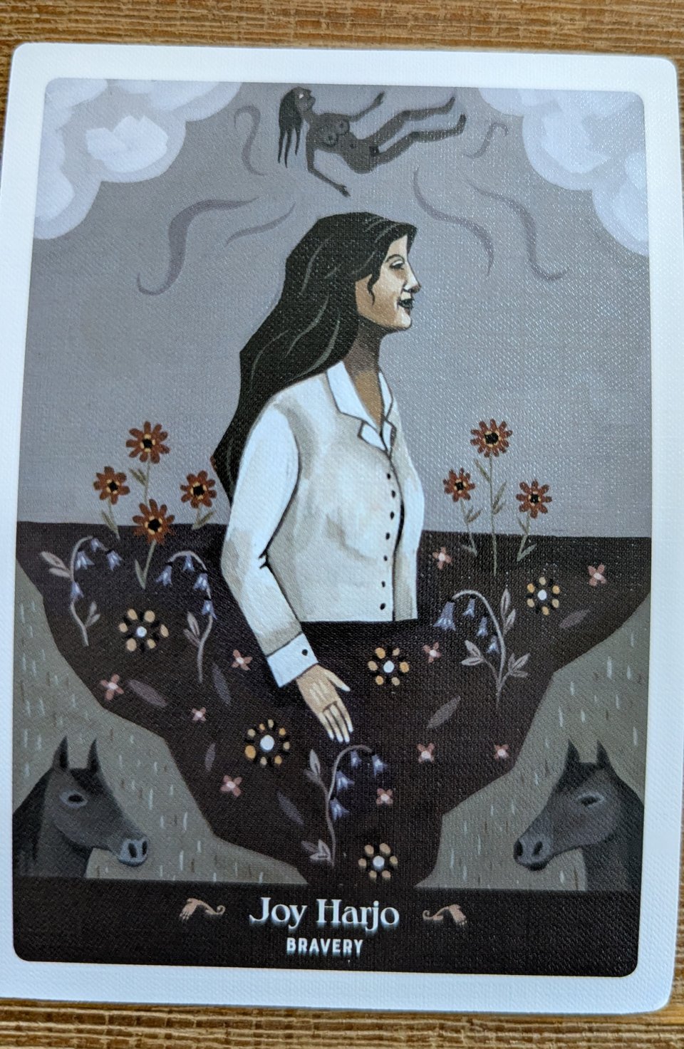 An illustration of the poet joy harjo, she is in profile, emerging from the earth.