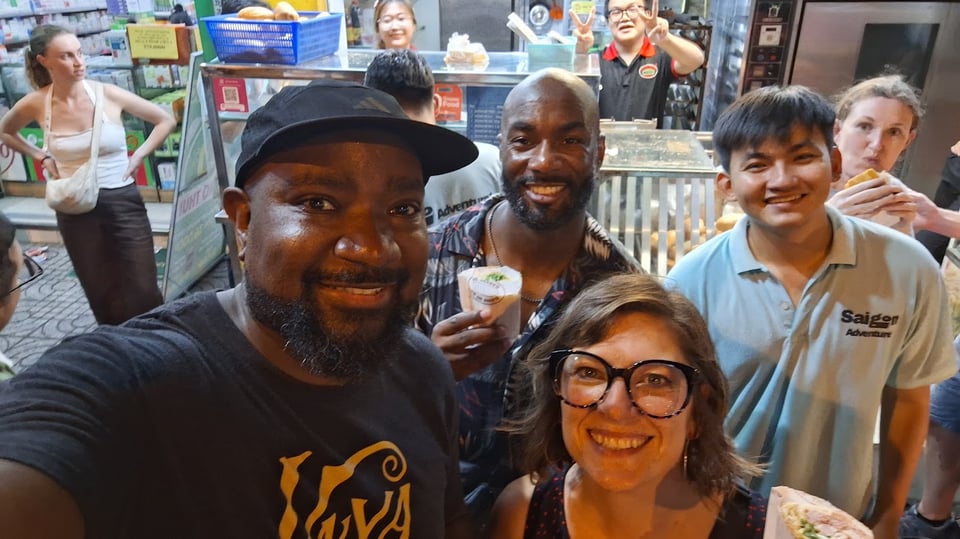 Photo posing in front of a Banh Mi cart in Saigon
