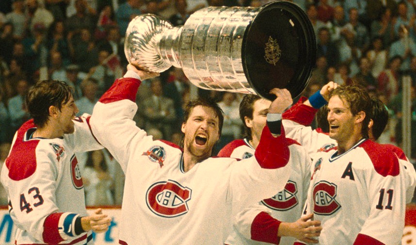 Patrick Roy of the Montreal Canadiens hoists the Stanley Cup the last time it was won by a Canadian-based hockey team. That was 32 years ago. In the previous 32-year span, Canadian teams won the Cup 22 times.