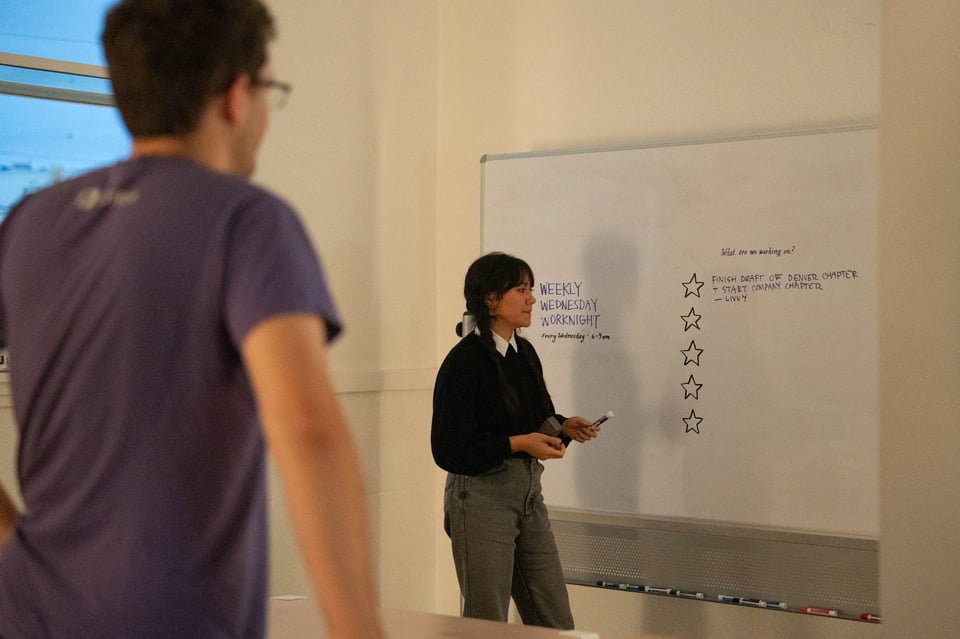 Livvy at a whiteboard.